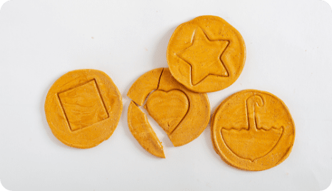 Dalgona in various shapes and broken heart-shaped dalgona